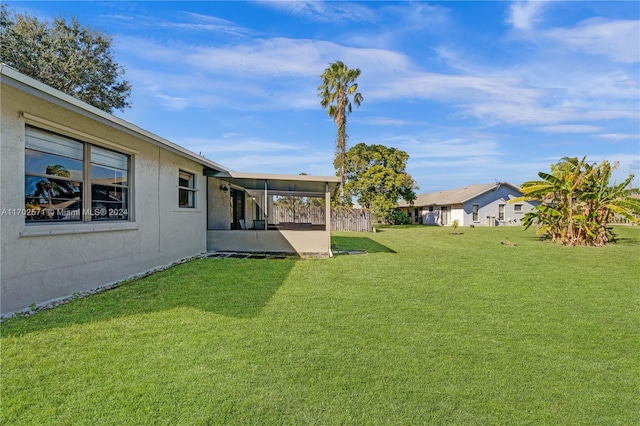 view of yard with a sunroom