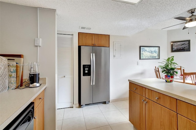 kitchen with stainless steel fridge, a textured ceiling, ceiling fan, light tile patterned floors, and dishwasher