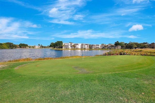 surrounding community featuring a water view