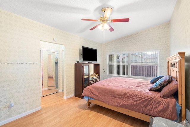 bedroom featuring ceiling fan and light wood-type flooring