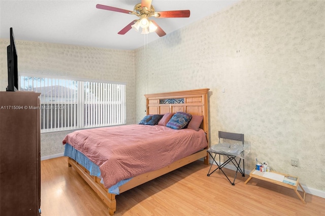 bedroom featuring wood-type flooring and ceiling fan