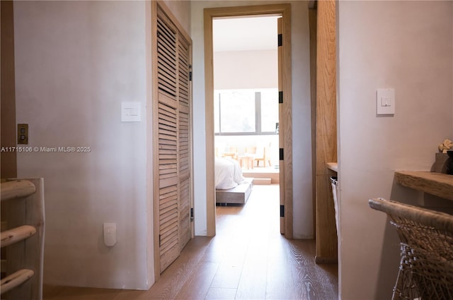 corridor with light hardwood / wood-style flooring