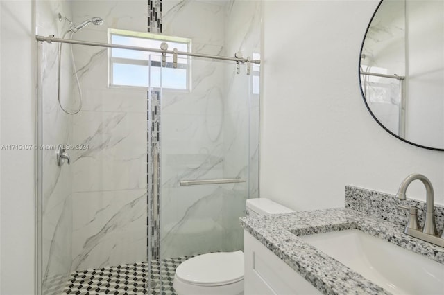 bathroom with vanity, toilet, and an enclosed shower