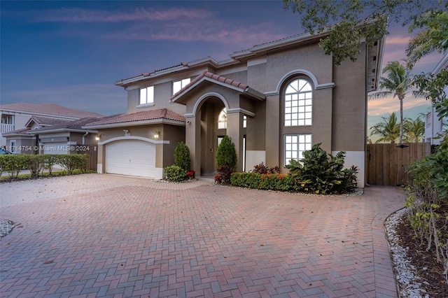 mediterranean / spanish-style home featuring a garage