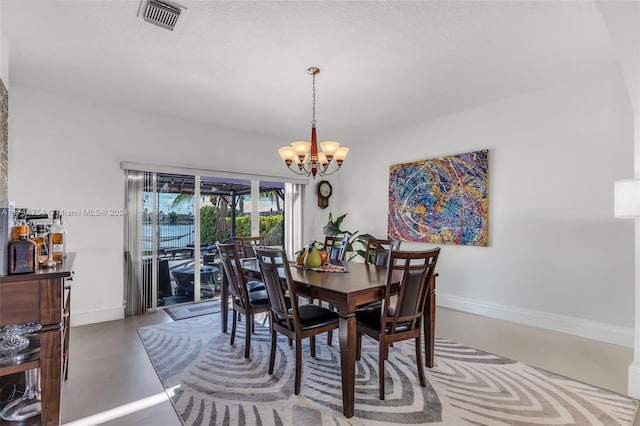 dining space featuring a chandelier