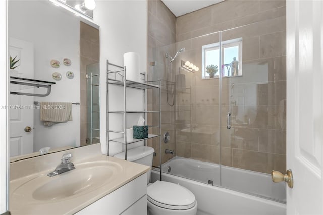 full bathroom featuring vanity, toilet, and enclosed tub / shower combo