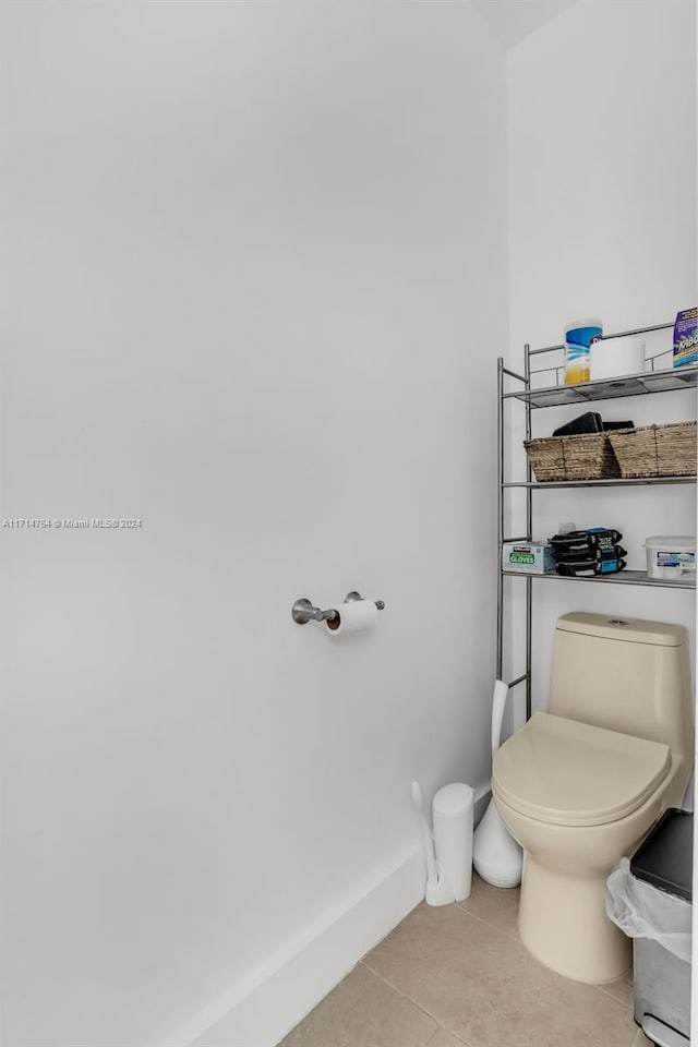 bathroom featuring tile patterned floors and toilet