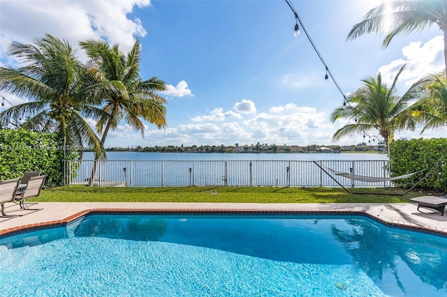 view of pool with a water view