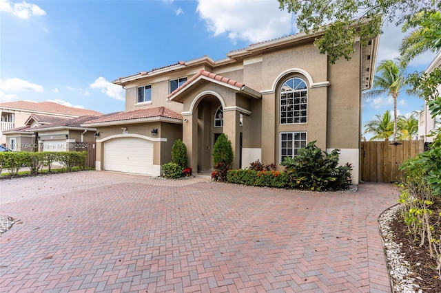 mediterranean / spanish-style house featuring a garage