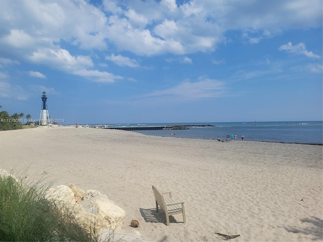 property view of water featuring a beach view