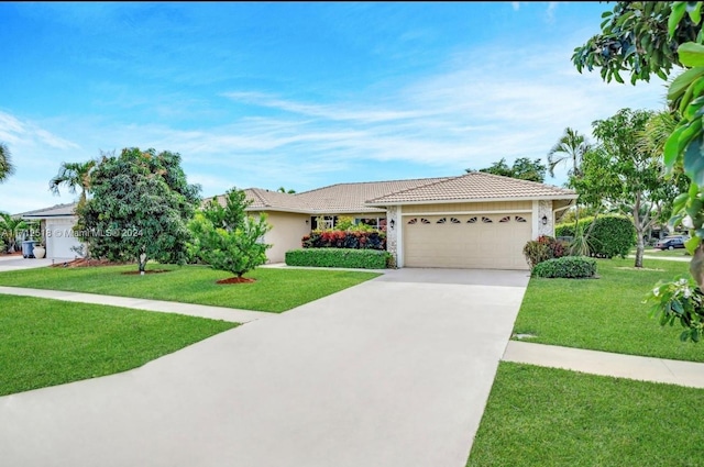 single story home featuring a garage and a front lawn