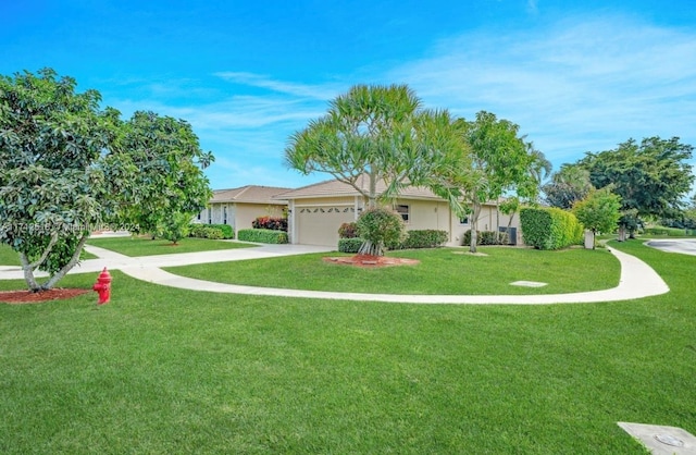 single story home featuring a front lawn and a garage