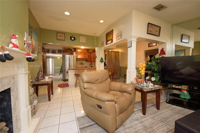 tiled living room featuring decorative columns