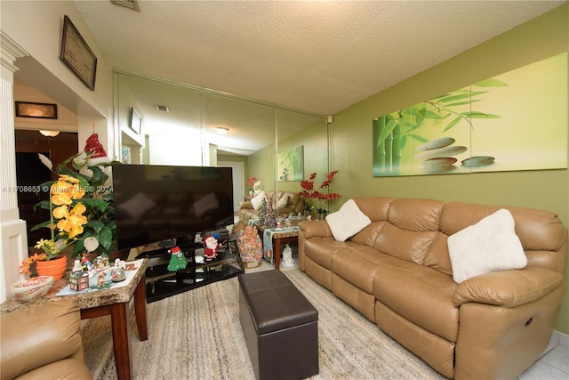 tiled living room with a textured ceiling