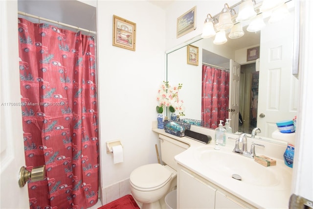 bathroom featuring tile patterned floors, vanity, a shower with shower curtain, and toilet