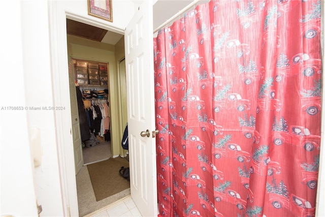 bathroom with tile patterned floors