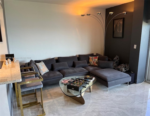 living area with marble finish floor