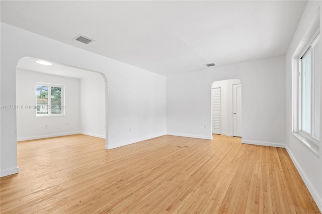 spare room featuring light hardwood / wood-style floors