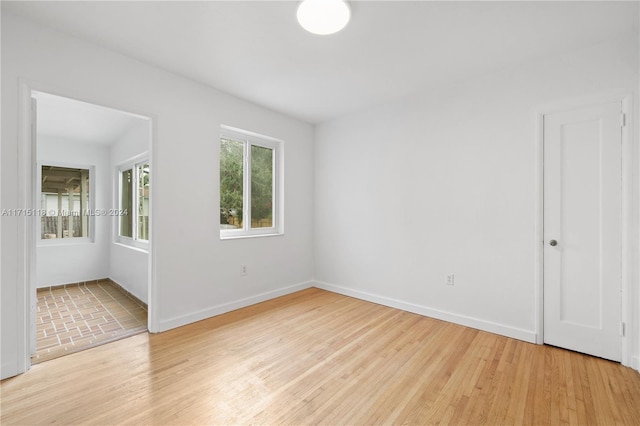 spare room featuring light hardwood / wood-style flooring