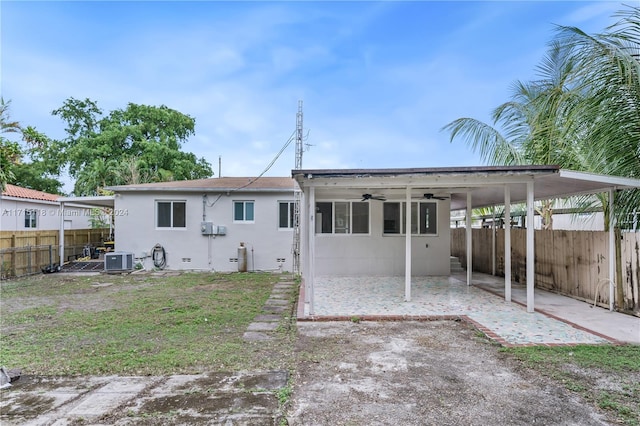 rear view of house featuring ceiling fan, a patio, and central AC unit