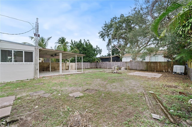 view of yard featuring ceiling fan