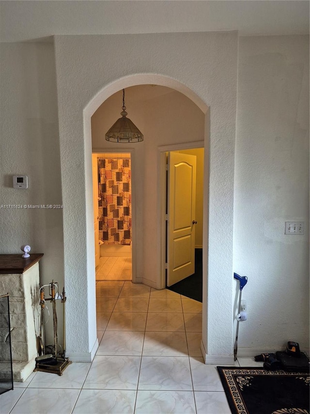 hallway with light tile patterned floors