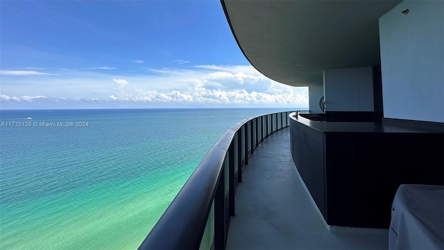 balcony featuring a water view