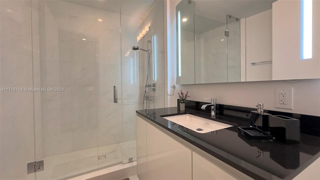 bathroom with vanity and an enclosed shower