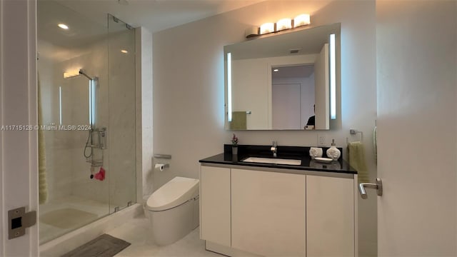 bathroom with tile patterned floors, vanity, an enclosed shower, and toilet