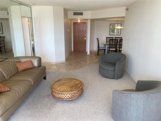 living room with a textured ceiling