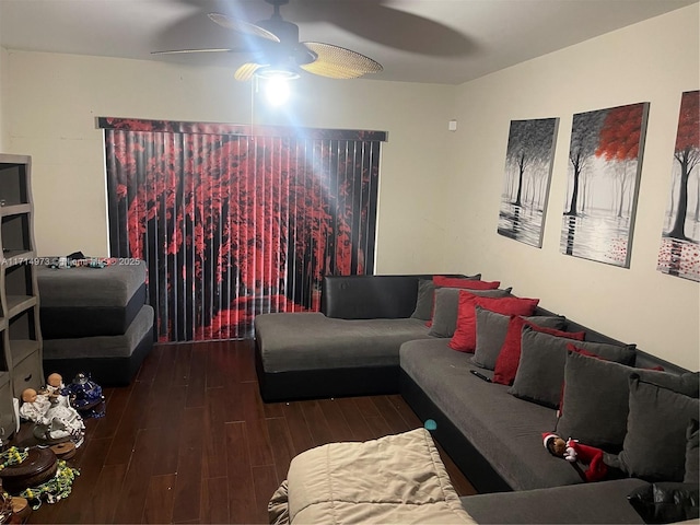 living room featuring ceiling fan and dark hardwood / wood-style floors