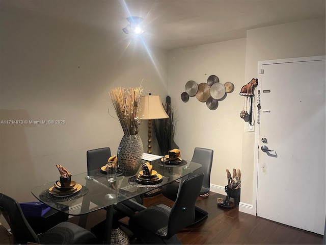 dining space featuring dark hardwood / wood-style flooring