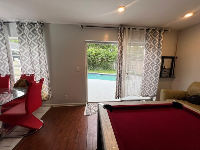 game room with hardwood / wood-style flooring and billiards