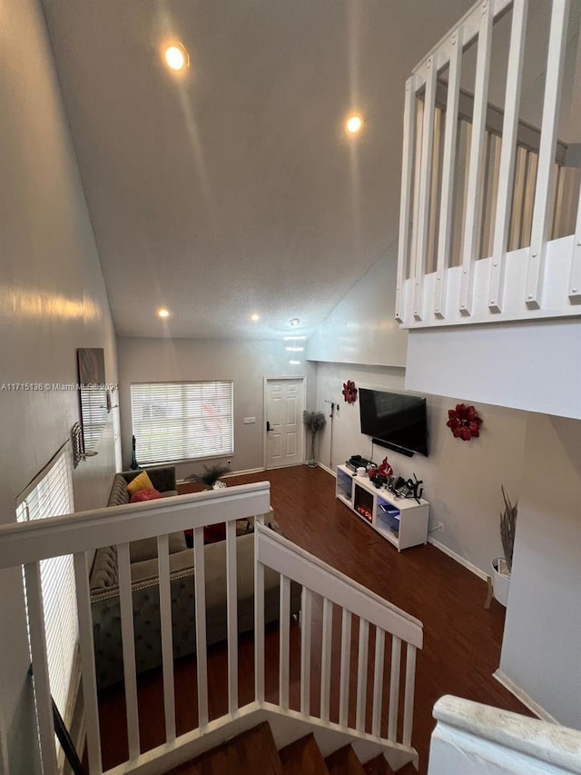 staircase with hardwood / wood-style floors