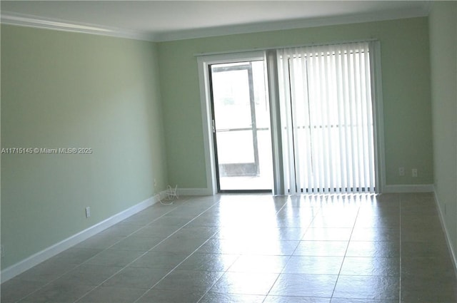 spare room featuring crown molding