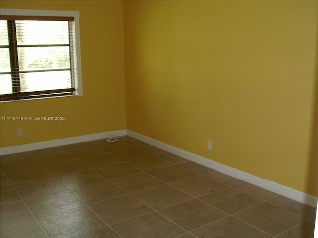 view of tiled spare room