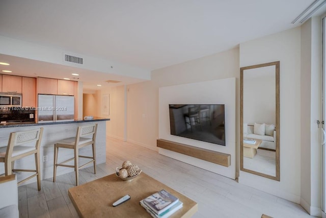 living room with light hardwood / wood-style floors