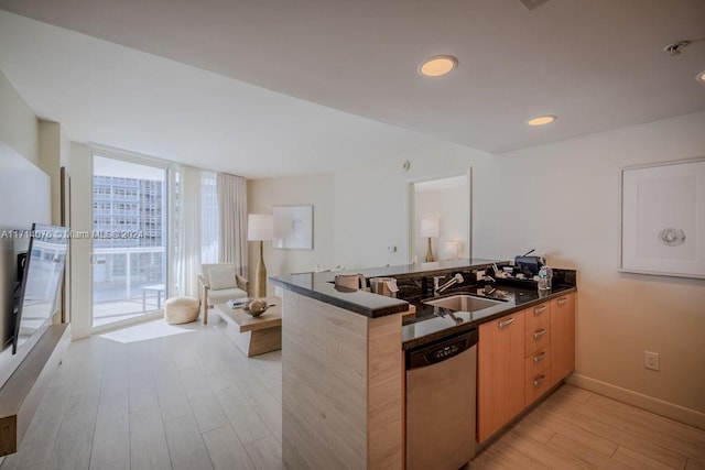 kitchen with dishwasher, floor to ceiling windows, sink, light wood-type flooring, and kitchen peninsula