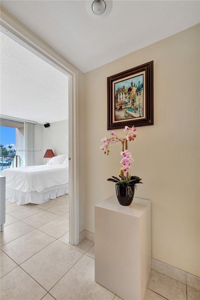 hallway with light tile patterned floors