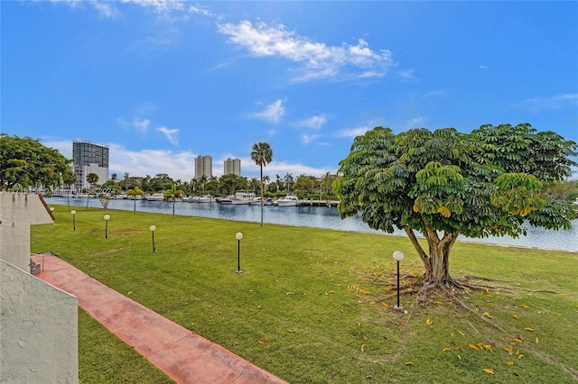 exterior space featuring a yard and a water view