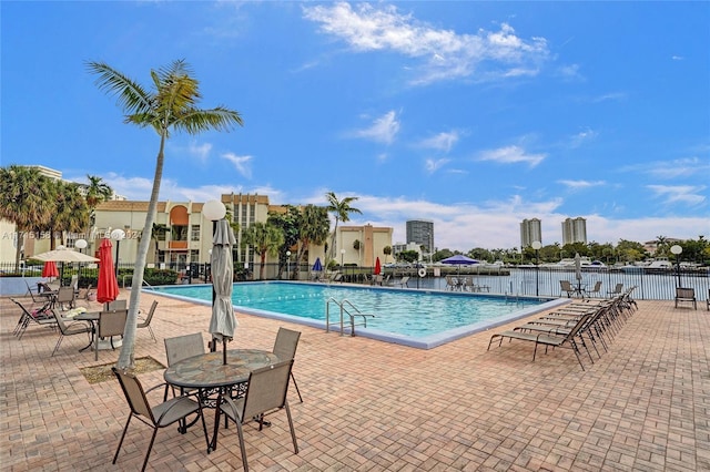 view of swimming pool featuring a patio