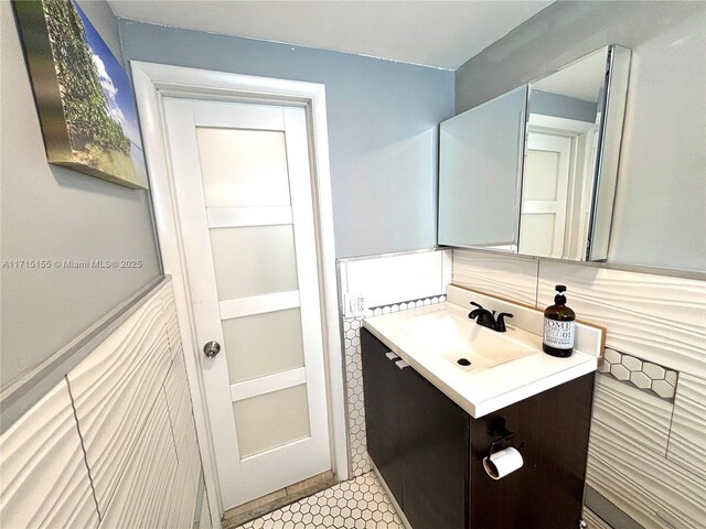 bathroom with vanity and tile patterned floors