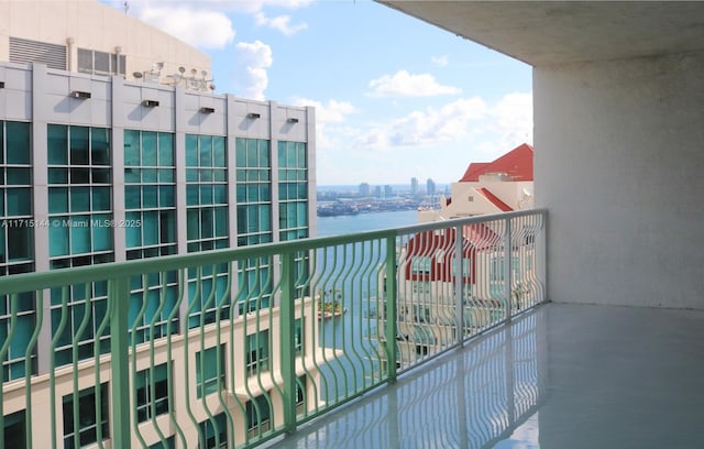 balcony featuring a water view