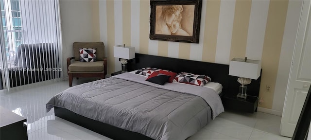 bedroom featuring light tile patterned floors