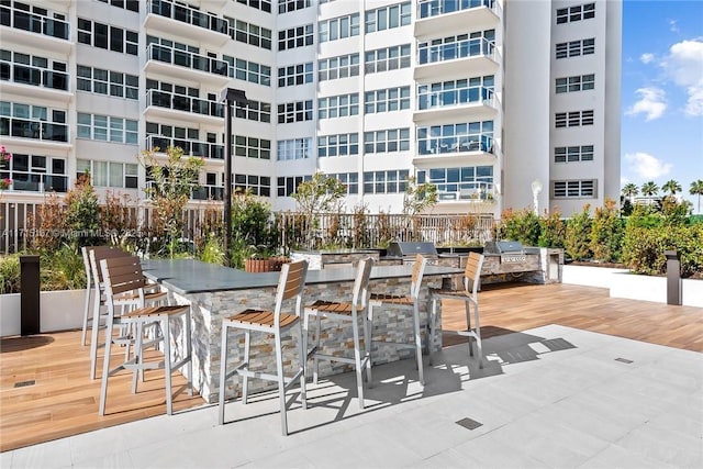view of patio featuring outdoor dry bar and area for grilling