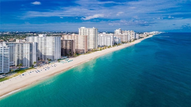 aerial view featuring a water view and a beach view