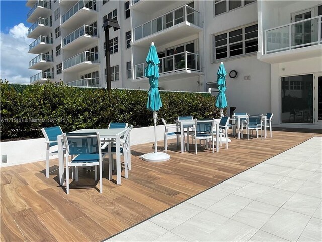3750 Galt Ocean Dr Unit 1602, Fort Lauderdale, FL 33308 - view of patio with outdoor dining space and a wooden deck