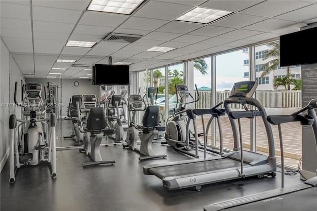 3750 Galt Ocean Dr Unit 1602, Fort Lauderdale, FL 33308 - exercise room featuring healthy amount of natural light, a wall of windows, and a drop ceiling