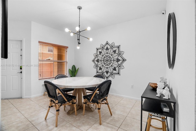 dining area featuring light tile patterned floors and a chandelier