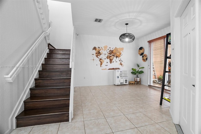 stairs with tile patterned flooring